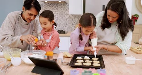 Family Baking Cookies Together in Home Kitchen