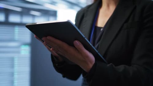 Programmer Managing Data Center Using Digital Device Close Up