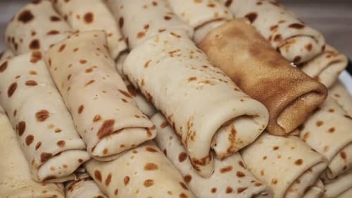 Pile of Delicious Rolled Crepes Close Up