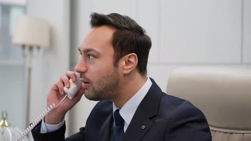 Businessman talking on the phone. European man angry, frustrated and furious with his lane phone