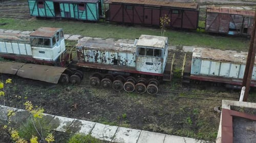 Aerial View of Old Rusty Locomotives and Wagons of a Narrow Gauge Railway