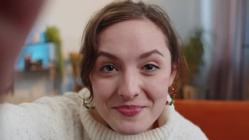 Smiling Woman Waving in Close Up