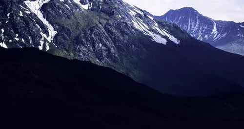 Majestic Mountain Ranges Illuminated By the Soft Glow of Twilight Colors