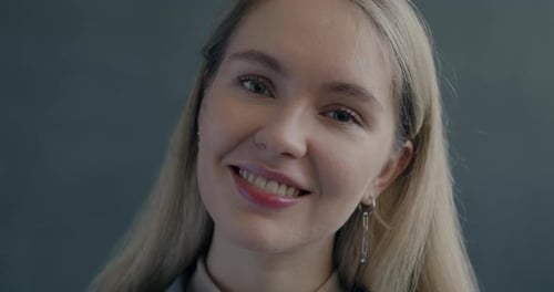 Smiling Woman with Blonde Hair Close Up Portrait