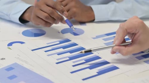 Close up of Business People Working on Documents