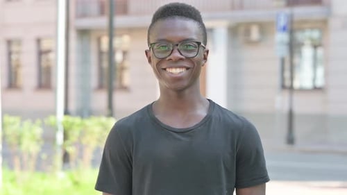 Happy Young Adult Smiling in Urban Environment