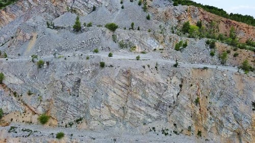 Natural Quarry is Located Near Road Against Backdrop of Rhodope Mountains and Hills with Forests and