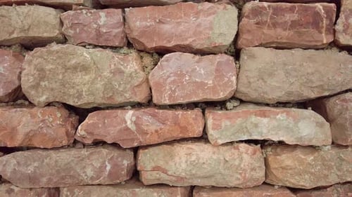 Rough Red Stone Wall Close-Up