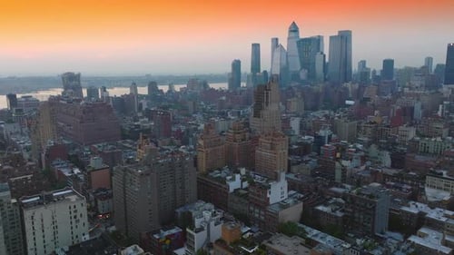Unbelievable panorama of stunning New York architecture against beautiful orange sky.
