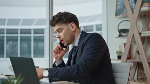 Worried Manager Calling Cellphone Discussing Business Report in Office Closeup