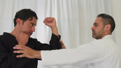 Martial Arts Training with Man in Black Uniform