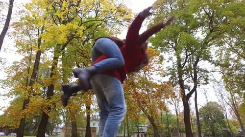 Happy young couple having fun in autumn park romance and relationships