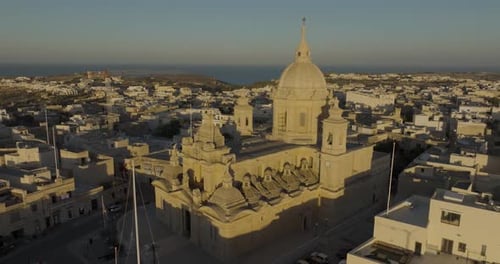 Aerial view of Nadur Parish Church at sunset, Malta.