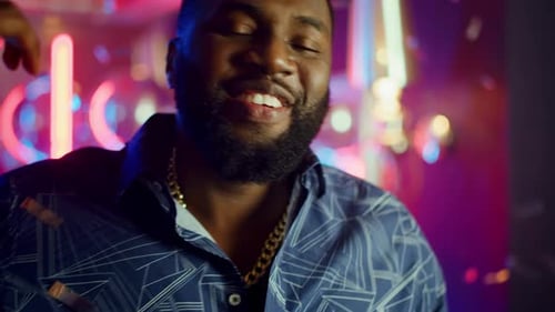 African American Guy Singing in Club. Portrait of Attractive African Guy Gesticulating