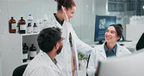 Scientists Celebrate Success in Modern Laboratory