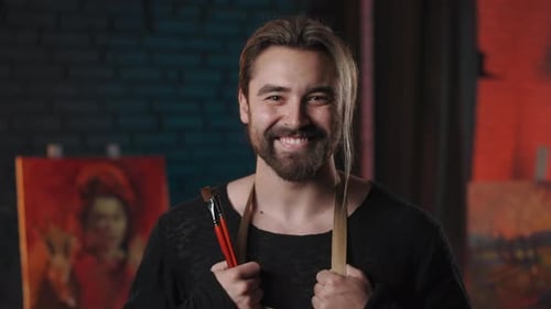 Portrait of Artist Posing at Art Studio with Smile on Face
