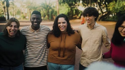 Happy multigenerational people with different ethnicities having fun together in a public park