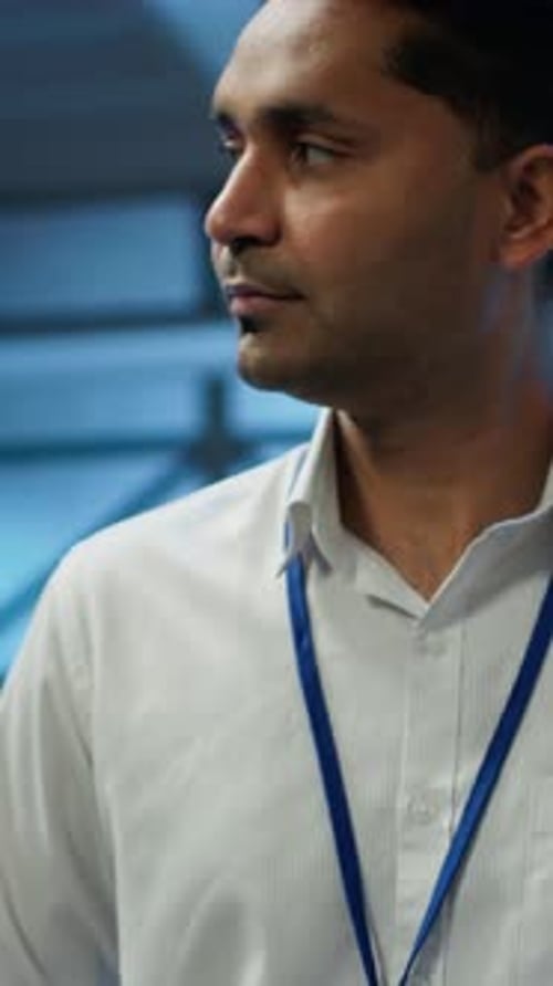 Vertical Video System Administrator Walking in Data Center Used for Managing Gear Energy