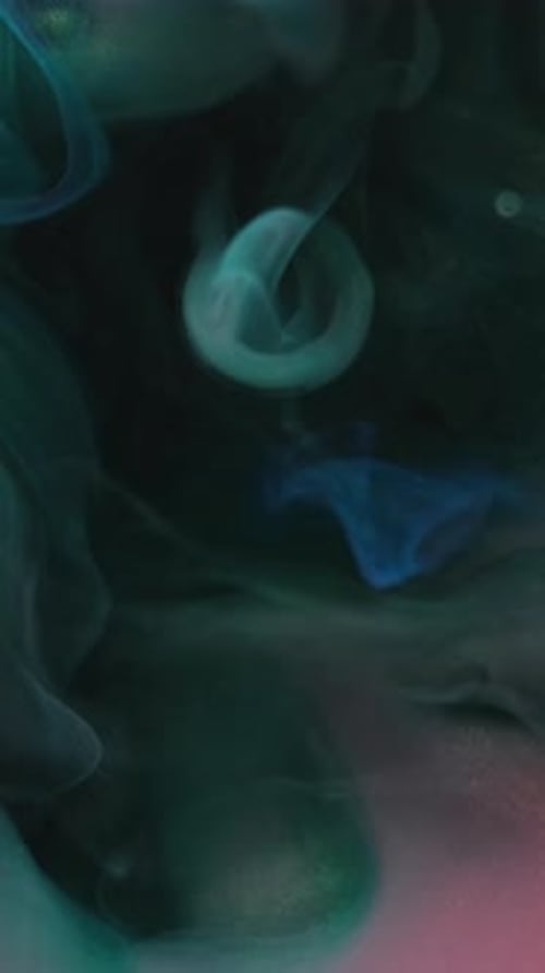 Swirling Turquoise Fluid Forms Abstract Shapes in Water