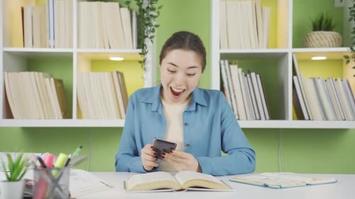 Excited Student Receiving Good News on Phone