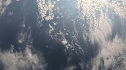 Timelapse Fluffy Cirrus Clouds Moving in Bright Sunset Sky Abstract Aerial Nature Summer Ocean