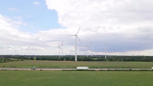 Wind turbines next to highway