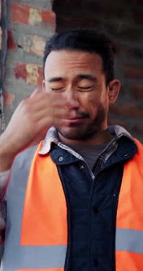 Helmet, thinking or man with stress at construction site, overwhelmed or renovation project