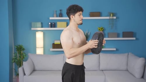 Shirtless Man Doing Bicep Curls with Weighted Plate