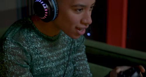 Enthusiastic Gamer Playing Video Game at Night