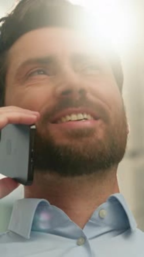 Close Up Caucasian Business Man Smiling Talking Mobile Phone Outside Sunny City Discussing Deal
