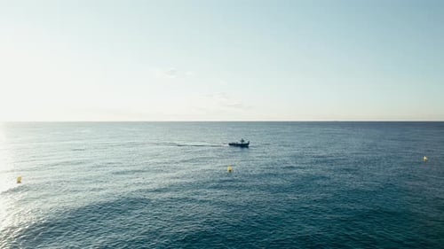 Fishermen in Small Boat Trawling Sardines and Sea Fish in Ocean