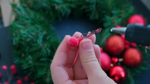 Christmas Wreath Decoration with Red Ornaments and Berries