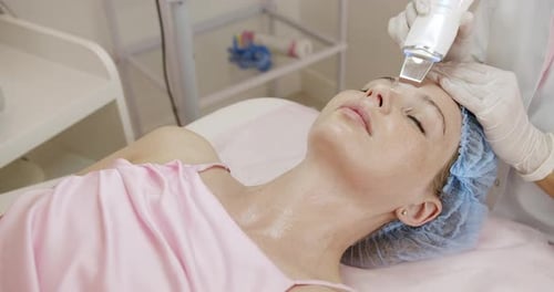 Professional Aesthetician Conducts Facial Treatment in Spa Clinic