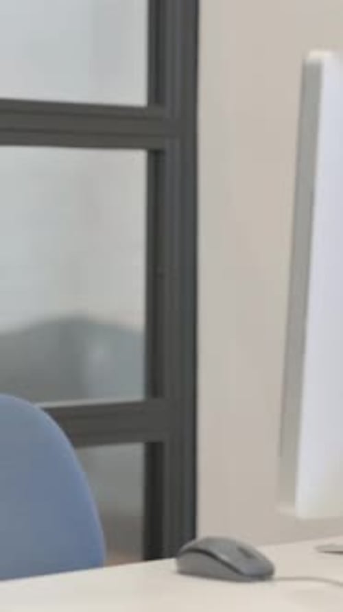 Mature Adult Man Coming and Starting Work on Desktop Computer
