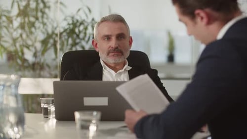 The CEO of a Financial Company Holds a Meeting in the Office The Director of the Company Together