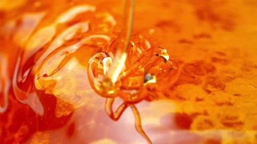 Golden Honey and Honeycomb Close-Up: Pure Natural Sweetness in Motion