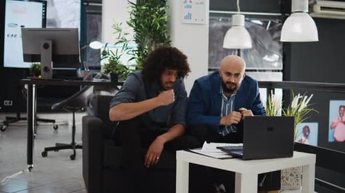 Successful Businessmen Collaborate at the Office