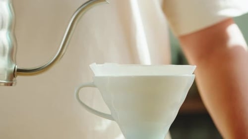 Pouring Water into Coffee Filter for Pour Over