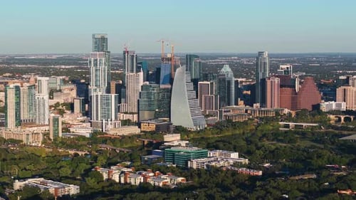 Panoramic drone shot of the downtown Austin skyline, golden hour in Texas, USA