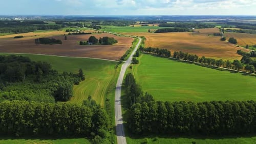 A Stunning Aerial View Showcasing Beautiful Lush Green Fields and Winding Rural Roads Throughout the