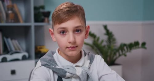 Smiling Blond Child Looking at the Camera