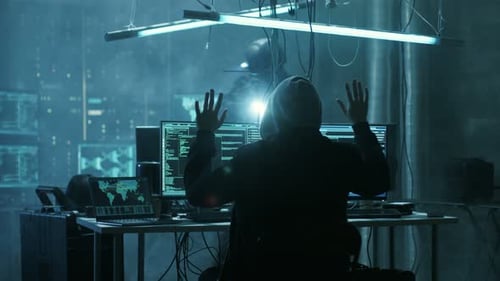 Hooded Hacker Surrenders to Armed Law Enforcement