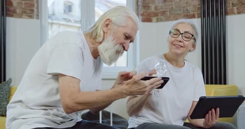 Senior Couple Using Technology at Home