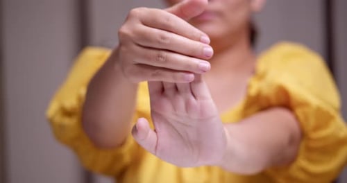 Close Up Hand Massage With Lotion Indoors