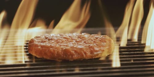 Frying burger meat on grill