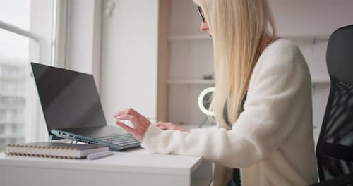 Young Beautiful White Blonde Woman in Casual Clothes Closing Laptop Lid Finishing Online Work or
