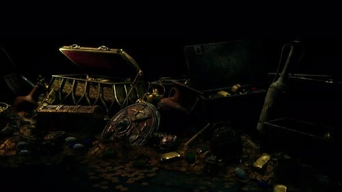 Handful of Gold Jewelry on a Dark Background