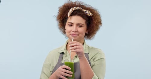 Happy woman, smoothie and diet for lose weight, detox or natural nutrition against a studio