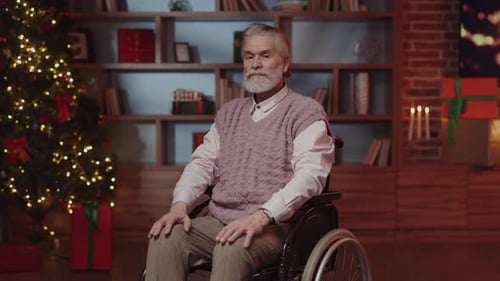 Man in Wheelchair by Christmas Tree