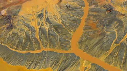 Flying over decanting lake. Colorful AMD acid mine drainage waters aerial view